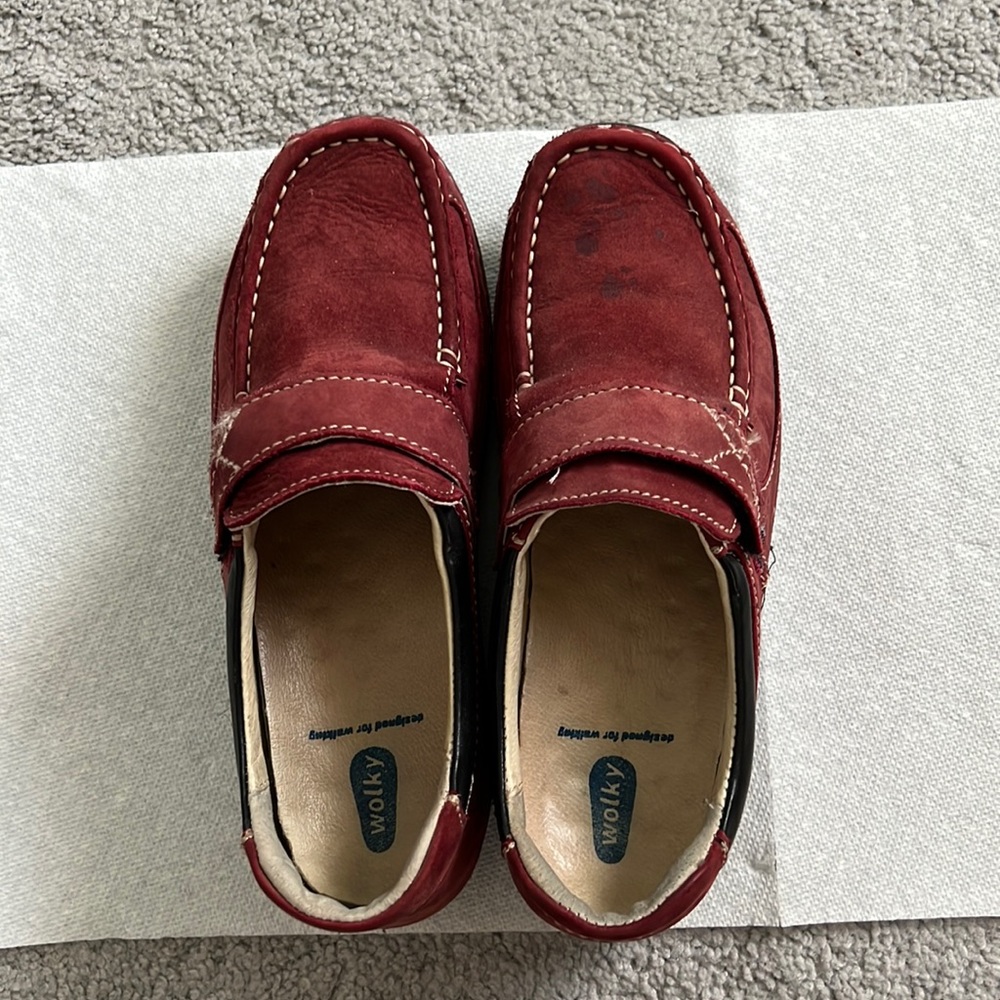 Ladies loafer type shoe European cut. Watermark on Top of left shoe
